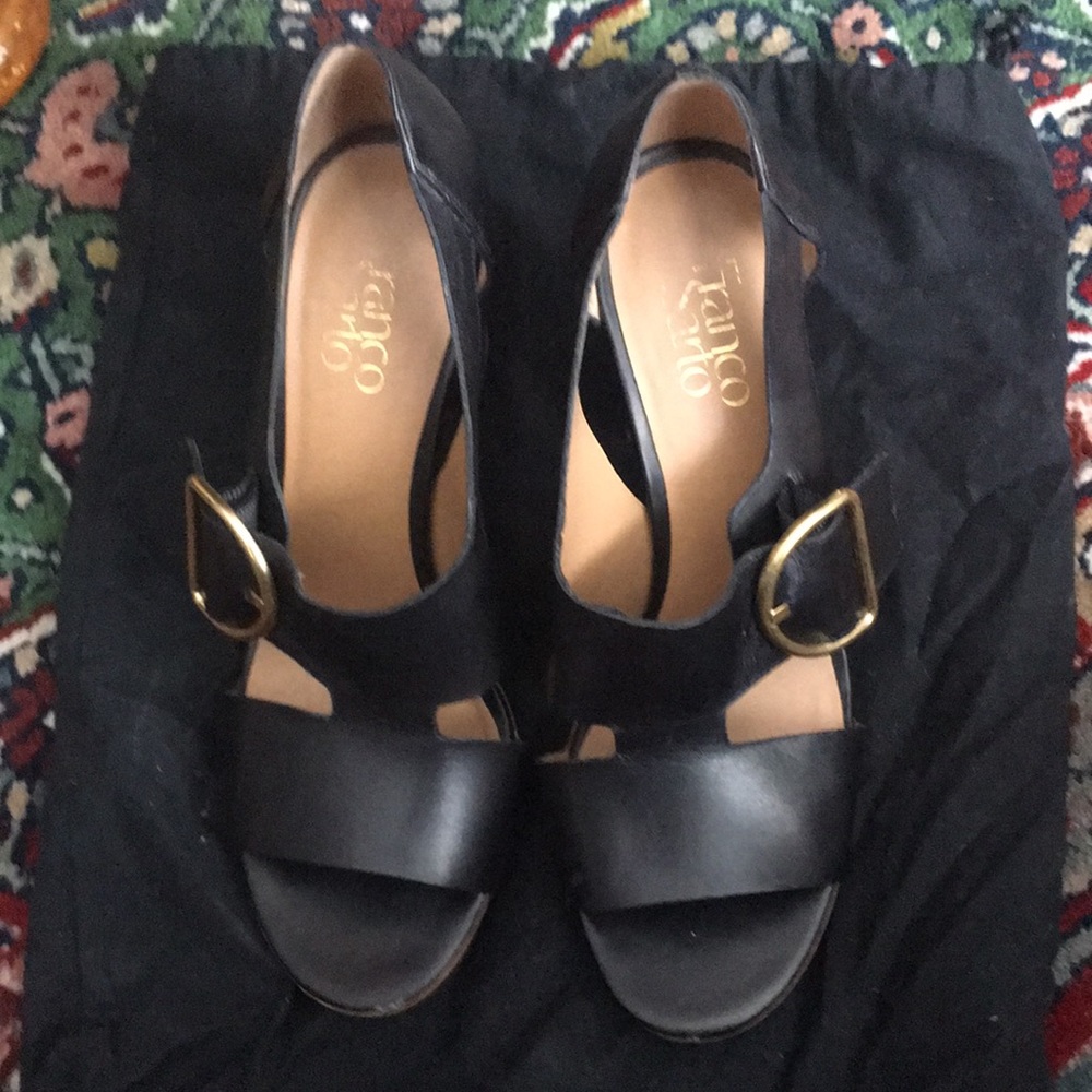 Franco Sarto black sandal leather strap with a side gold buckle .
